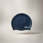 LUWA Apex navy blue silicone swim cap with a hydrodynamic shape for reduced drag and comfortable fit.