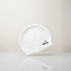 Luwa Apex swim cap in ivory, made from premium silicone for comfort and durability. Features a hydrodynamic shape.