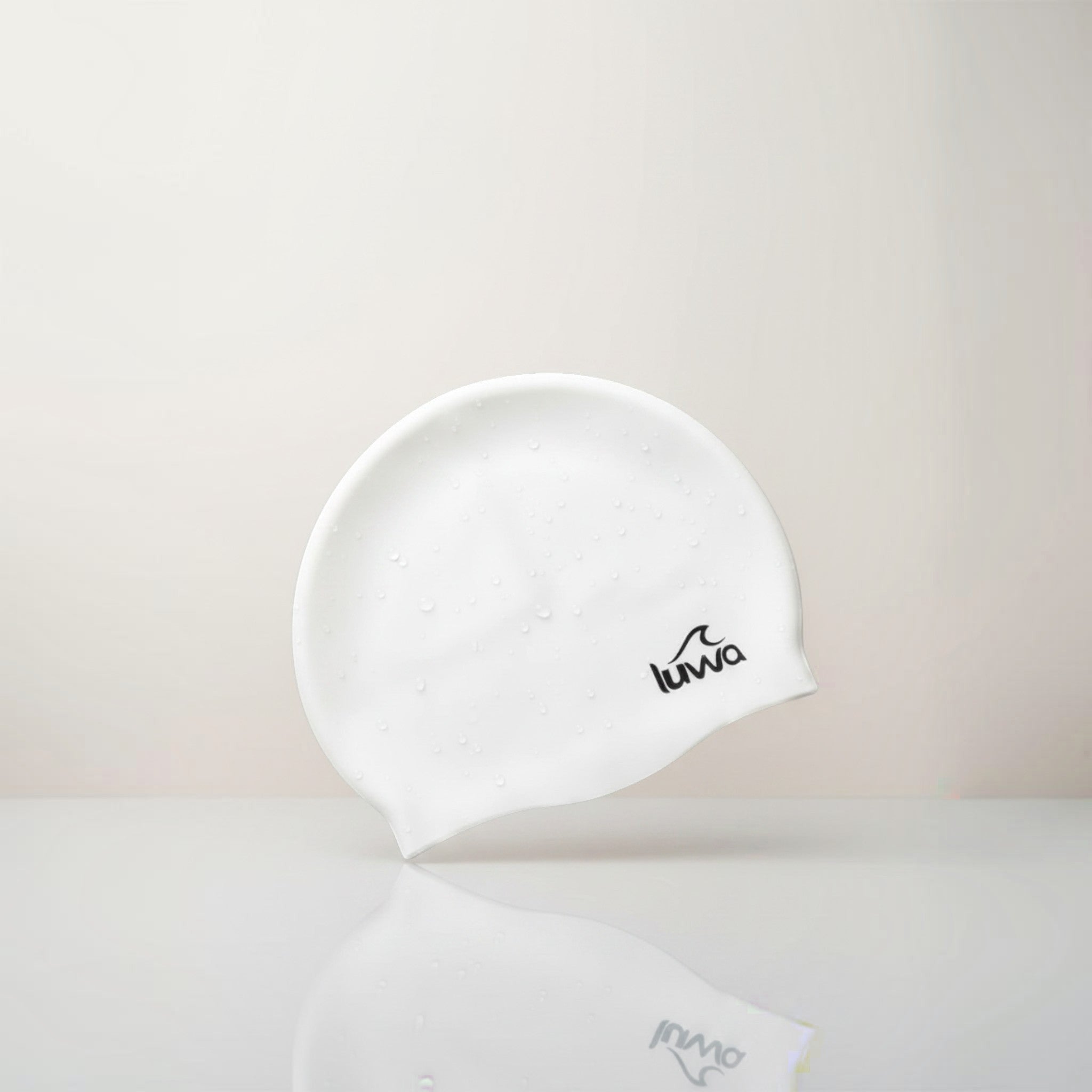 Luwa Apex swim cap in ivory, made from premium silicone for comfort and durability. Features a hydrodynamic shape.