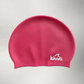 luwa Apex swim cap in bright pink silicone with white logo. Comfortable, durable, and hydrodynamic for training.