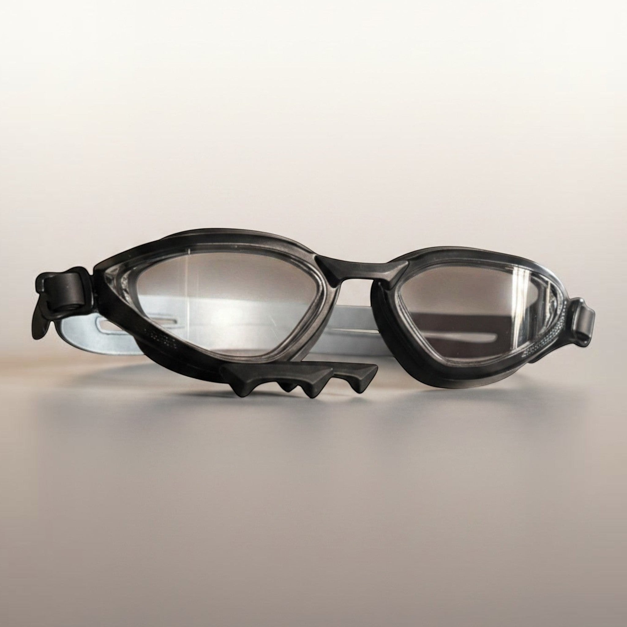 luwa Apex Vision Pro black training goggles with clear, anti-fog lenses and adjustable nose bridge.
