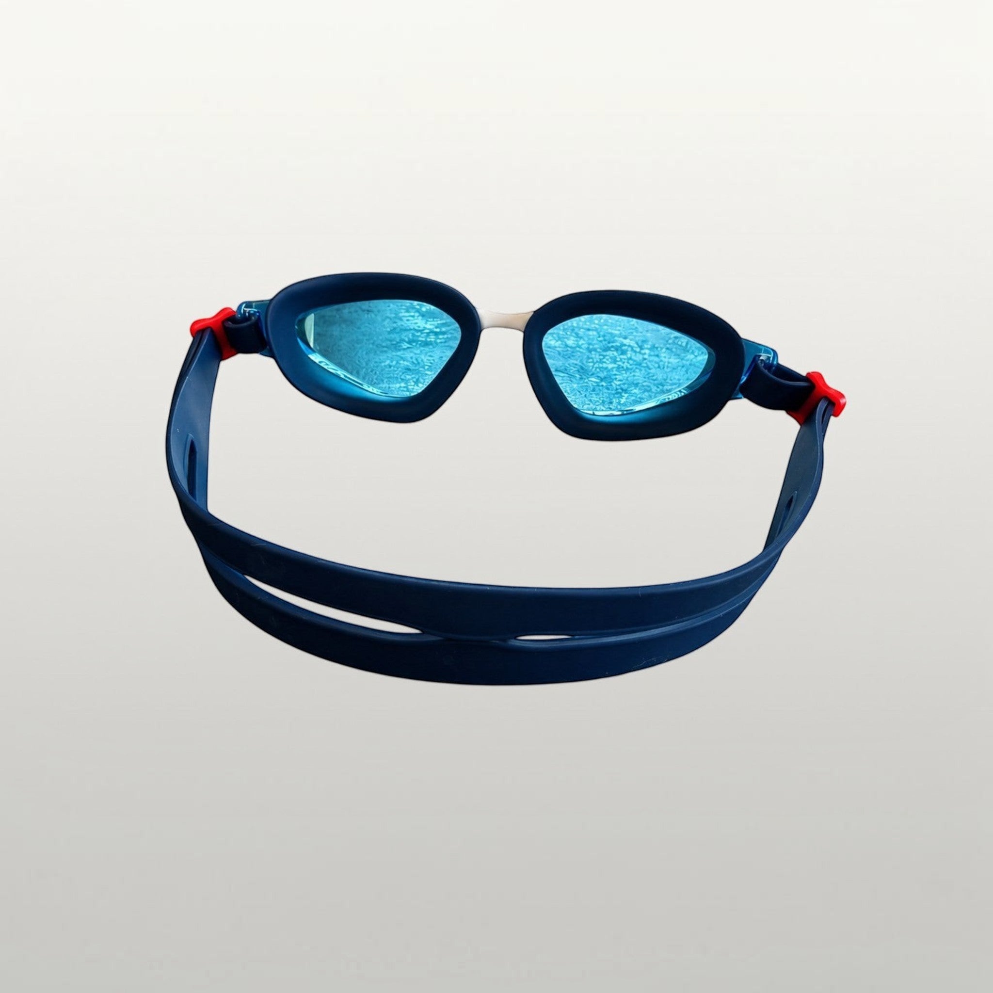luwa Apex Vision Pro blue and white swim goggles with adjustable strap and blue lenses.