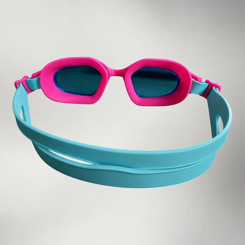 luwa Coral Flash swim goggles with pink frame, blue lenses, and light blue strap. Features anti-fog and anti-slip design.