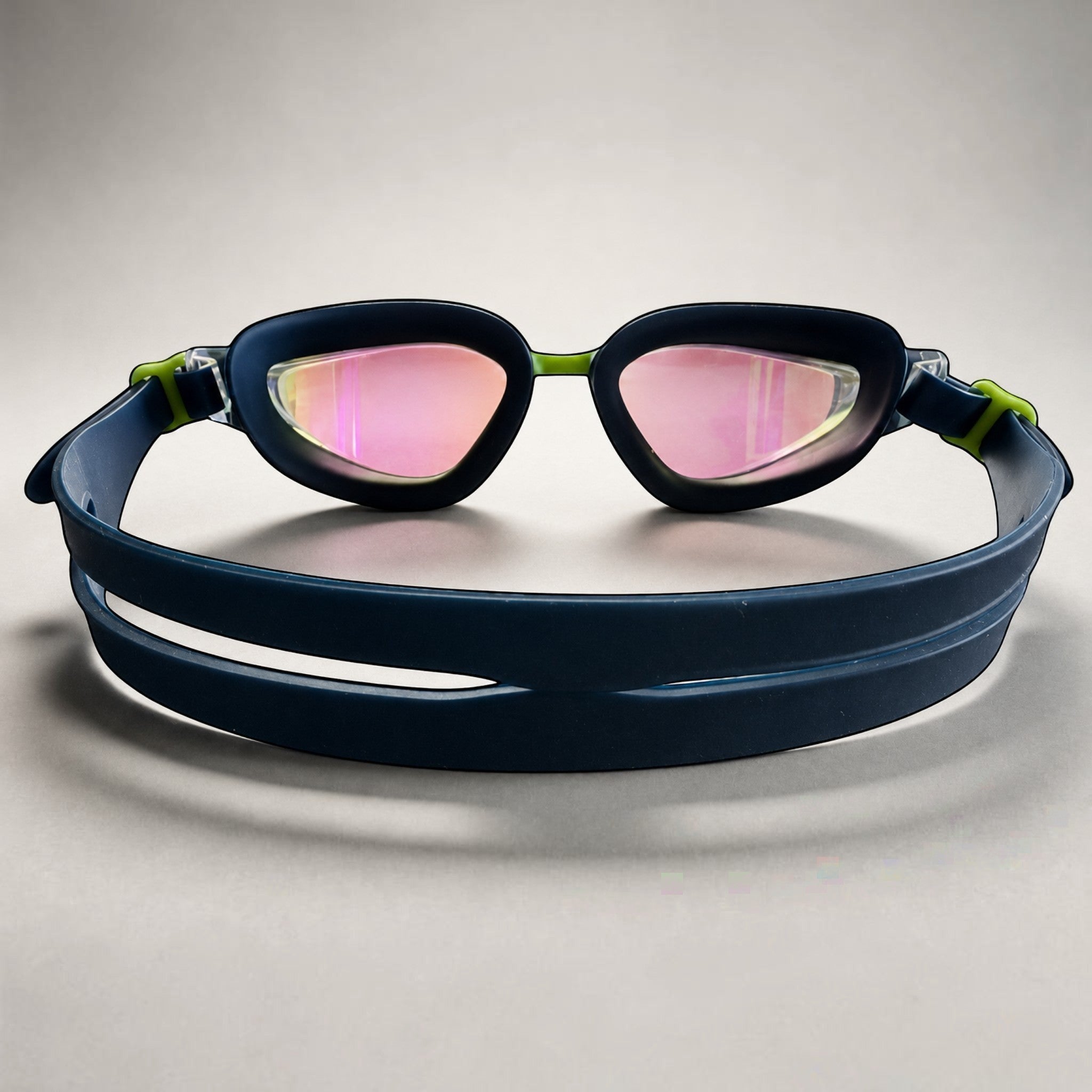 luwa navy blue performance swimming goggles with pink mirrored anti-fog lenses and lime green accents.